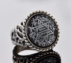 "Handmade Sterling silver Turkish special products # Metal : 925 Sterling Silver # Weight : 12.55 gr Stone Size :21.00 The seal of Solomon, also known as the face of Hz. Solomon's ring is said to have powers. There has been some curiosity about what he wrote on his seal, Süleyman. On this face, there is the secret \"Ismi Azam\" prayer of the angels and human beings who are outside of human beings. Name Prayer Meaning There is no god but Allah. However, He is Jalil and Jabbar. There is no god but Silver Star Of David Spiritual Rings, Silver Spiritual Rings With Star Of David, Silver Engraved Star Of David Ring, Silver Star Of David Ring In Spiritual Style, Solomons Ring, There Is No God, David Star, Seal Of Solomon, Unique Mens Rings