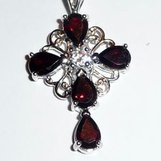 Peora Silver Cross Shaped Garnet Necklace/Pendant Has 5 Pear-Shaped Genuine Garnets And One Cz Stone. Prong Setting Spring Ring Clasp Has A 17" Inch .925 Silver Snake Chain With A Lobster Claw Clasp. Stamped .925 Cross Set On Filigree Back. Condition Is New Elegant Red Cross Pendant Jewelry, Beaded Boho Necklace, Face Necklace, Silver Necklace Set, Chunky Chain Necklaces, Garnet Necklace, Silver Snake Chain, Bronze Pendant, Cross Jewelry