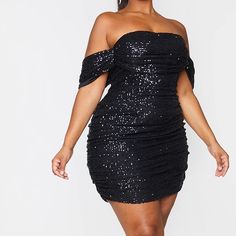 Look All Kinds Of Glam In This Black Birthday Dress Doll. Featuring A Black Sequin Material With A Bardot Neckline And Ruched Detailing, Wear This With Lace-Up Heels And Diamante Accessories. Length Approx 82cm/32" (Based On A Sample Size Uk 16) Model Wears Size Uk 16/ Eu 44/ Aus 16/ Us 12 Model Height - 5ft 7" Fitted Off-shoulder Sequin Dress For Date Night, Ruched Mini Dress For Holiday Party, Fitted Knee-length Sequin Dress For Night Out, Black Bodycon Sequin Dress For Date Night, Fitted Black Bodycon Dress For Holiday Party, Bodycon Mini Dress For Holiday Party, Black Fitted Bodycon Dress For Holiday Party, Black Fitted Dressy Sequin Dress, Black Fitted Flirty Sequin Dress