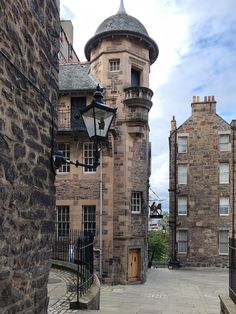 an old stone building with a clock tower