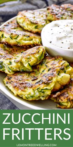 zucchini fritters on a white plate with a bowl of ranch dressing