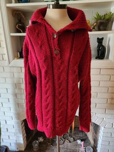 This is an incredible sleeveless piece. Looks to be hand made, and it's really well done. Large cable knit in a lovely dark red color. Straight line shape to the body, and some extra material at the neck. Two decorative buttons on the right side of the collar, and three down the front. Is it a long sweater or a short dress? Yes! Is it from the 70s? 80s? 90s? That I can't tell you. It is finely made, heavy weight, but pretty soft and comfy. Whether you wear it as a sweater or a dress, you'll be warm and look great. It's in amazing condition with years of life left! Here are the exact measurements taken laying flat (be sure to reference the last photo to see how I measure dresses) Bust 22" Waist 20" Sleeve 24" Length 32" Dark Red Color, Vintage Long Sleeve, Straight Line, Long Sweater, Decorative Buttons, Well Done, Long Sweaters, Dress Clothes For Women, Short Dress