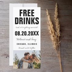 a wedding save the dates card with a photo on it next to a dried plant