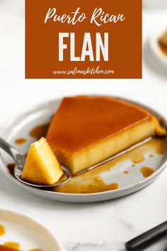 a piece of flan on a plate with caramel sauce and spoons next to it