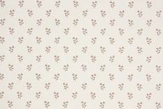 a white wallpaper with small brown flowers on the top and bottom half of it