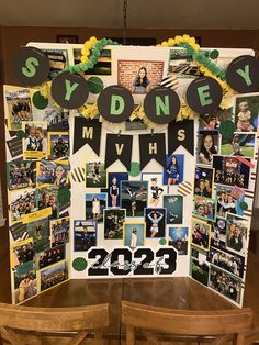 a table topped with pictures and decorations for a sports themed birthday party that is decorated in green, yellow and black