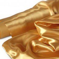 gold satin fabric on white background