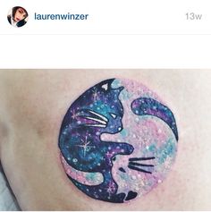 a cat and moon tattoo on the side of a woman's stomach, with stars in the background