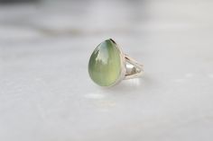 Natural Prehnite sterling silver ring, Gemstone Jewelry, Prehnite jewelry, Christmas Gift, silver jewelry, July Birthstone ring, Minimalist Be assured that the product you order is CUSTOM MADE JUST FOR YOU and is not a mass produced item. The gemstone is a Pear Shaped Prehnite of 13 x 18mm. The Ring is made from 925 STERLING SILVER i.e. 92.5% pure silver. And it DOESN'T HAVE ANY LEAD OR NICKEL. Please note that silver will tarnish with time , it is a natural property of silver to tarnish so to p Green Cabochon Moonstone Ring For Anniversary, Anniversary Green Cabochon Moonstone Ring, Green Polished Sterling Silver Gemstones, Green Sterling Silver Gemstones With Polished Finish, Green Cabochon Moonstone Ring In Sterling Silver, Green Oval Moonstone Ring In Sterling Silver, Silver Teardrop Emerald Ring Gift, Green Sterling Silver Moonstone Ring Gift, Green Sterling Silver Moonstone Ring