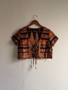 Made from scratch with Indonesian batik fabric ততততততততততততততততততততততততততততততততততত ✺ Only 1 piece available for this design ✺ Super unique piece as you'll be the only one wearing it ptp ≈ 20" shoulder: 16.5" length: 16" sleeve: 7.5" fits ≈ UK 6-10 ✧ The fabric is very delicate so please take note to wash the apparel separately in cold water for the first wash & avoid using harsh detergents to preserve the colour & condition of the apparel ✧ Avoid soaking the apparel ✧ Do machine wash it in a lau Multicolor Batik Print Short Sleeve Top, Multicolor Short Sleeve Tops With Batik Print, Cotton Vintage Print Festival Tops, Festival Cotton Top With Vintage Print, Cotton Top With Vintage Print For Festival, Vintage Print Cotton Tops For Festival, Traditional Brown Printed Top, Festival Multicolor Print Cotton Tops, Patterned Short Sleeve Tops With Batik Print