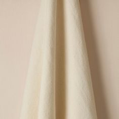 a white towel hanging on the wall