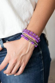 Product Description A mismatched assortment of silver, purple, and crackling purple glass-like beads are threaded along stretchy band around the wrist, creating colorful layers. Sold as one set of four bracelets. Adjustable Purple Beaded Bracelet With Silver Beads, Adjustable Purple Jewelry With Silver Beads, Purple Bracelet With Silver Beads, Adjustable Purple Faceted Beads Stretch Bracelet, Adjustable Purple Stretch Bracelet With Faceted Beads, Purple Stackable Jewelry With Round Beads, Purple Stackable Beaded Bracelets With Round Beads, Purple Bracelets, Purple Bracelet