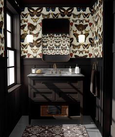 a bathroom with a sink, mirror and rug