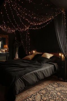 a bedroom with lights strung from the ceiling