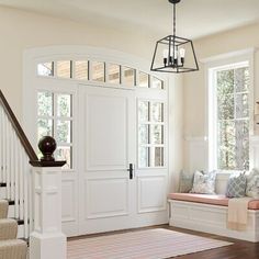 the entryway is clean and ready for guests to use it as a sitting area