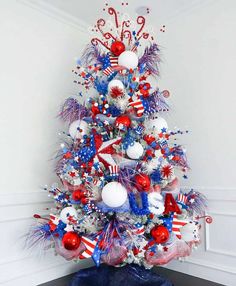 a decorated christmas tree with red, white and blue decorations