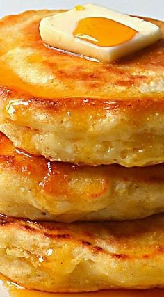 stack of pancakes with butter and syrup on top