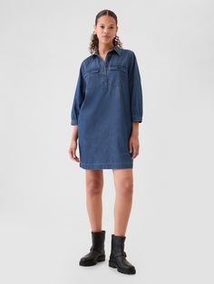 Soft denim pullover mini shirtdress.  Point collar, quarter button closure.  3/4 sleeves with button cuffs.  Button-flap utility pockets at chest.  Responsibly Made: This denim dress is part of our water-saving Washwell program.  Compared with conventional wash methods, Washwell uses at least 20% less water and has saved over a billion liters of water since 2016.  Fit: Relaxed.  A shift silhouette with a relaxed & easy fit throughout.  For a Classic fit, go down one Denim Pullover, Utility Pockets, Water Saving, Dress Inspo, Dark Indigo, Gap Denim, Shirtdress, Workwear Dress, Women's Dresses