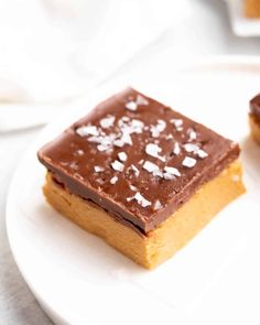 two pieces of cake sitting on top of a white plate