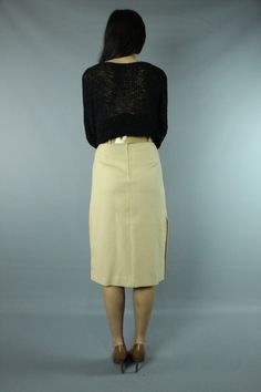 Vintage 80's high waisted skirt. Fitted, pencil styling. Buttons on the side seam of the skirt. Matching belt. Back zipper with buttons at the waist. Model is 5 ft. 7 in. and wears a size small in tops and a size 5 in bottoms. Condition: Excellent, unworn condition. Had tags on it, but I removed them for a photo shoot and misplaced them. Brand: T R Bentley Fabric: 50% Polyester, 50% Rayon Measurements: Taken flat, then doubled when necessary. Size tag: vintage size 5/6, probably fits an x-small Fitted Skirt With Belt Loops For Work, Office Pencil Skirt With Belt Loops, Retro Fitted Pencil Skirt For Spring, Spring Retro Fitted Pencil Skirt, Fitted Midi Skirt With Belt Loops, Retro Fitted Skirt With Belt Loops, Fitted Office Skirt With Belt Loops, Retro Fitted Midi Skirt, Vintage Fitted Midi Skirt