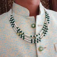 Indian Groom Pearl Necklace, Dulha Mala, Indian Wedding Men Jewelry, Sherwani Necklace For Groom, Indian Groom Jewelry, Pakistani Groom Mala 3 Layered Pearl Beads Necklace An elegant pearl beads necklace with the most stunning festoon. The perfect accessory for your occasion. This necklace is handcrafted with love Necklace Length: Choose from the drop-down menu (the length of the necklace in the image is 22 inches) Package: 1 Necklace Material: Premium Pearl beads, stone beads Care: Store in an airtight plastic bag or box. Keep away from water, moist place & fragrance For Express shipping, the option is available in the drop-down menu at checkout. If you need any help regarding placing an order or express shipping, feel free to message us DISCLAIMER: This product is made to order. Product Traditional Green Necklaces For Marriage, Traditional Green Kundan Necklace For Marriage, White Temple Jewelry Mala For Weddings, Traditional Bridal Necklace With Round Beads For Marriage, Traditional White Wedding Mala, Traditional Mala With Round Beads For Wedding, Green Mala For Wedding Festival Season, Green Mala For Wedding Festivals, Green Mala For Wedding And Festivals