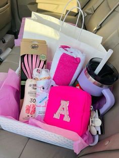 a car filled with personal care items and toiletries in the passenger side back seat