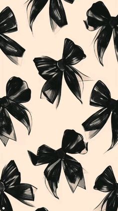 black and white bows are on the back of a wallpaper pattern that looks like it has been drawn