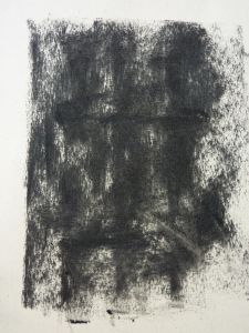 a black and white drawing on paper that looks like it has been smudged