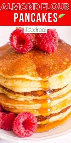 stack of pancakes with raspberries on top and the words almond flour pancakes above it