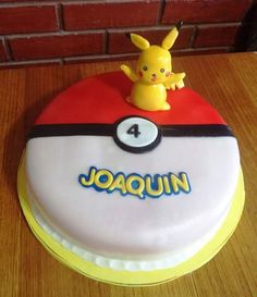 a pokemon themed birthday cake with a pikachu figure on top