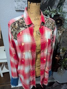 a mannequin wearing a red and white shirt