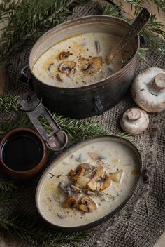 two bowls of mushroom soup on a table