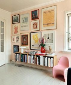 an instagram page with pictures on the wall and a pink chair next to it