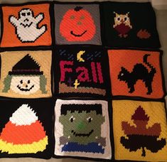 a crocheted blanket with halloween pictures on it