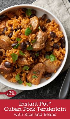 instant pot cuban pork and rice with black beans in a white bowl on top of a gray napkin