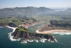 an aerial view of the coastline and town