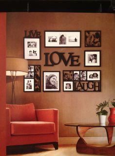 a living room filled with furniture and framed pictures on the wall above a coffee table