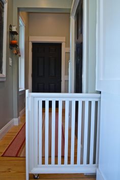 the inside of a house with text overlay that reads, inspiration for your kitchen remodel the hidden dog gate