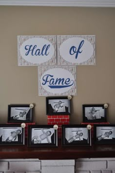 there are pictures on the mantle in front of some framed photos and a sign that says hall of fame