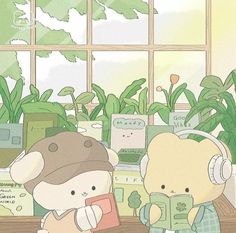 two teddy bears are sitting next to each other with headphones on and reading books