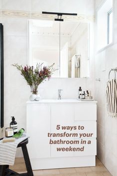 a bathroom with a sink, mirror and towel rack on the wall that says 5 ways to transform your bathroom in a weekend