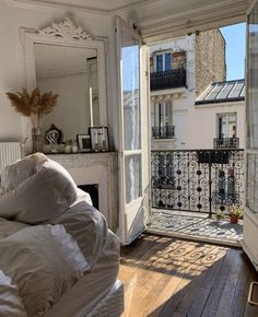 an open door leading to a bedroom with a balcony