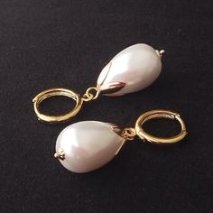 This style of earring was very popular during Renaissance times and appears in many portraits of the time. These earrings consist of round gold plated lever backs and white glass faux pearls. (In some pictures the pearls look pale blue but this is the reflection of the sky). Limited edition design. Gold plated lever backs. Length (from top of lever back to bottom of earring) 3.8cm (1.49 inches).  Please note: All photos are taken under natural light. However different computer screens, operating Classic Gold Baroque Earrings, Elegant Brass Hoop Earrings With French Hook, Elegant Gold Earrings With Lever Back, Classic Baroque Earrings For Formal Events, Classic Baroque Earrings For Formal Occasions, Gold Pearl Lever Back Earrings For Formal Events, Vintage Gold Earrings With Lever Back, Formal Gold Lever Back Earrings, Gold Lever Back Earrings For Formal Occasions