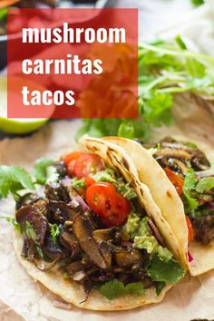 mushroom carnitas tacos with avocado, tomatoes and cilantro