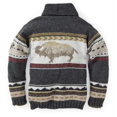 Yellowstone Sweater Jacket Looks like a sweater, wears like a jacket. All-American and made for the adventurist, our Yellowstone Sweater Jacket features a bold bison motif across the back – a symbol of abundance in some Indigenous traditions. Buffalo heads on the shoulders and arms are complemented by arrowhead and mountain patterns. Finished with a refined shawl collar, this sweater has a poly fleece lining and ribbing along the waist and cuffs for warmth. 100% wool. Fleece lined. Crafted by ar Yellowstone Sweater, Indigenous Traditions, Mens Khakis, Shawl Collar, Sweater Jacket, Buffalo, Shawl, Wool, Collar