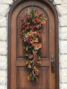 a wreath is hanging on the front door