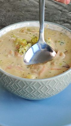 a spoon in a bowl filled with soup