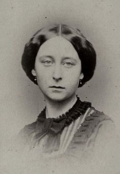 an old black and white photo of a woman with her eyes closed, looking to the side