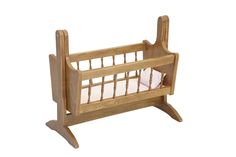 a wooden crib with a white pillow in it