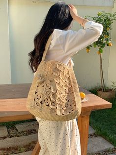 Indulge in luxury and elevate your style with our handmade raffia straw shoulder bag. With a boho design of circular and oval patches, this medium-sized tote exudes elegance and durability. The natural raffia color adds a touch of sophistication, while the shoulder strap allows for comfortable carrying. Perfect for any occasion, this bag is a must-have statement piece. Natural Soft Raffia Straw Handmade Unlined Inside pocket Size: 12"H x 9.5"W x 4"D Strap drop length: 12" Designer Style ID: 8619 Bohemian Shoulder Bag With Round Handle For Beach, Straw Bag With Round Handle For Beach, Beige Straw Shoulder Bag With Round Handle, Jute Tote Hobo Bag, Spring Bohemian Hobo Bag In Natural Color, Beige Crochet Straw Bag With Round Handle, Beige Straw Crochet Bag, Bohemian Natural Hobo Bag For Spring, Bohemian Beige Bags With Open Weave